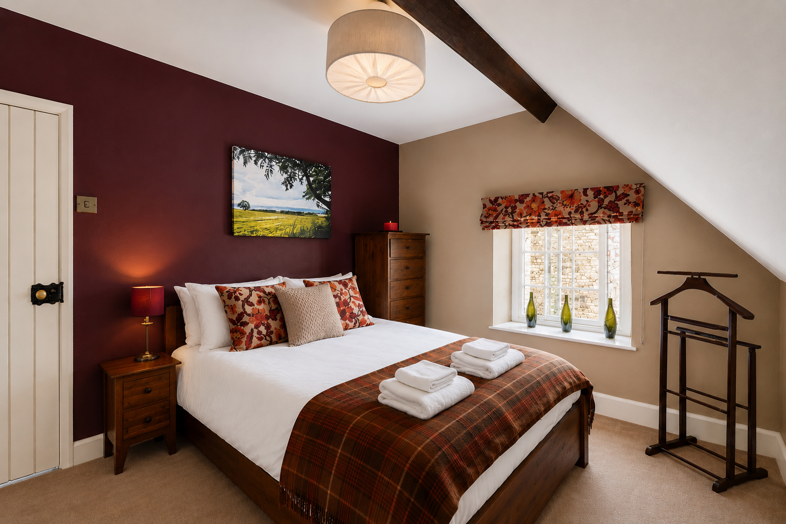 Double bedroom with feature wall and local Yorkshire artwork at Yew Tree Cottage Westow